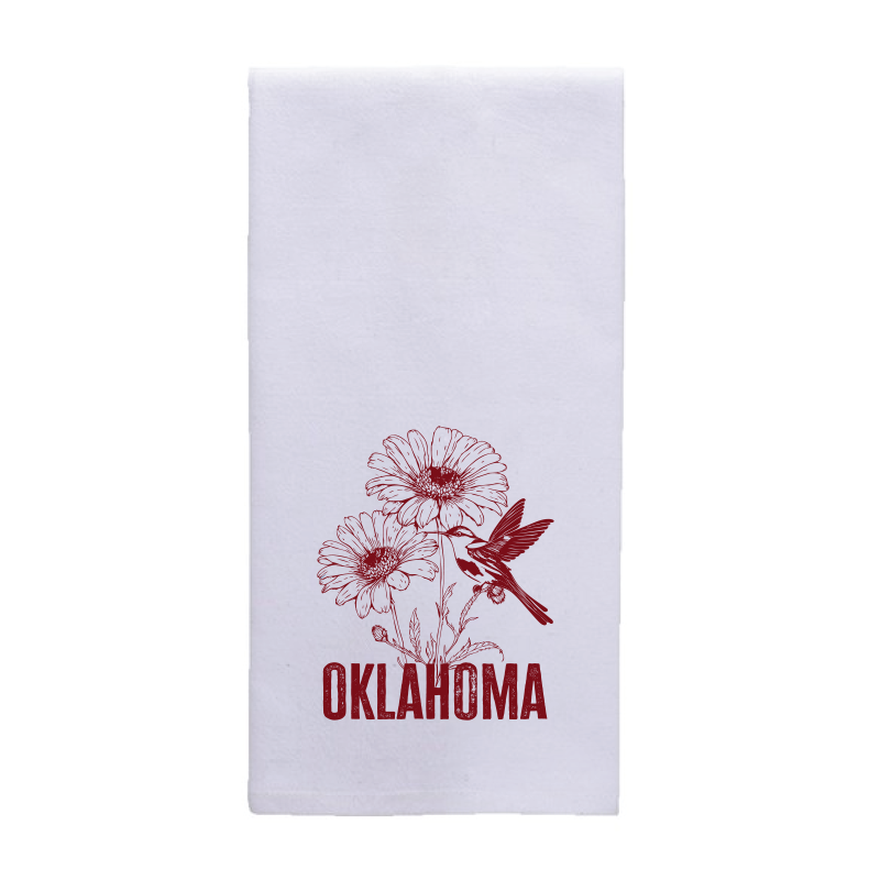 White tea towel featuring a red graphic of a blanket flower and scissor-tailed flycatcher.